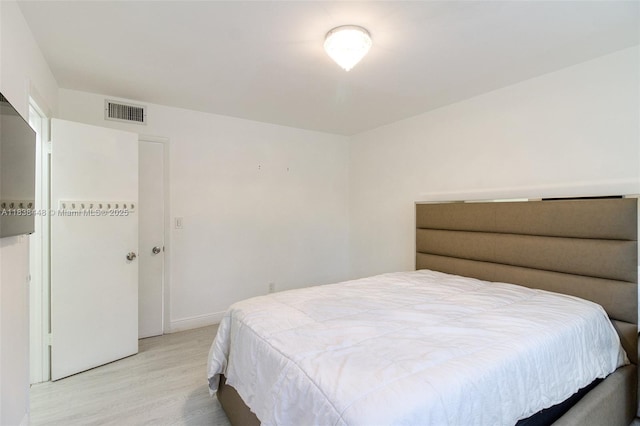 5387 SW 40th Ave Unit 202, Dania Beach, FL 33314 - bedroom with light wood-style flooring and baseboards
