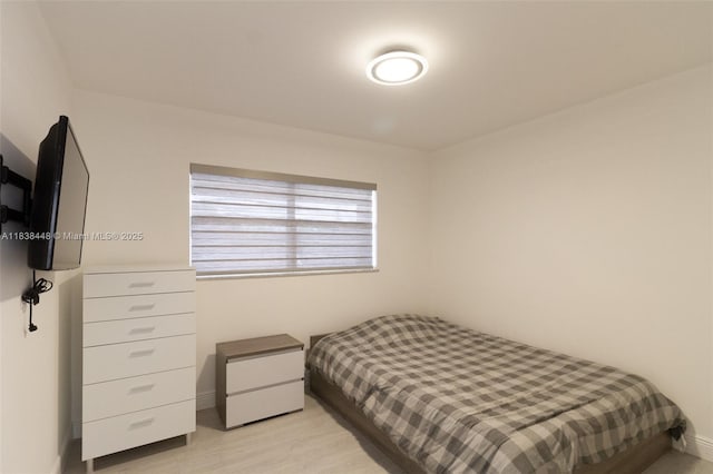 5387 SW 40th Ave Unit 202, Dania Beach, FL 33314 - bedroom featuring light wood-style floors and baseboards