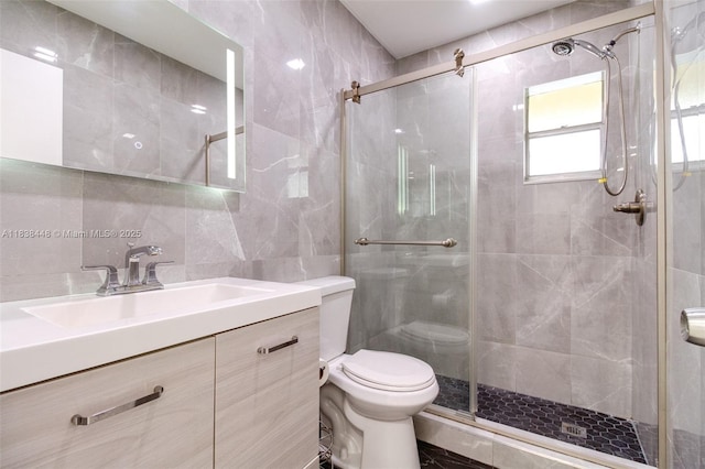 5387 SW 40th Ave Unit 202, Dania Beach, FL 33314 - bathroom featuring tile walls, a shower stall, and vanity