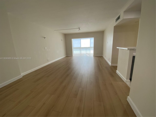 4400 Hillcrest Dr Unit 314B, Hollywood, FL 33021 - unfurnished room featuring wood finished floors and baseboards