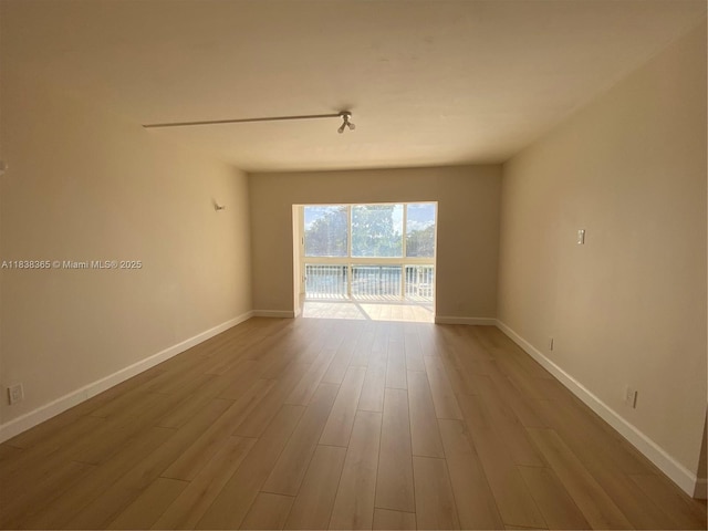 4400 Hillcrest Dr Unit 314B, Hollywood, FL 33021 - empty room featuring wood finished floors and baseboards