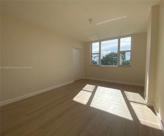 4400 Hillcrest Dr Unit 314B, Hollywood, FL 33021 - empty room featuring dark wood finished floors and baseboards