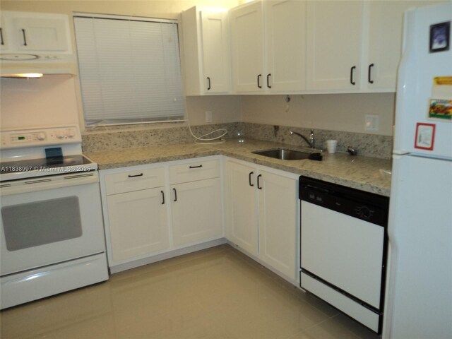 1050 93rd St Unit 6F, Bay Harbor Islands, FL 33154 - kitchen with white appliances, under cabinet range hood, white cabinets, light stone counters, and light tile patterned flooring