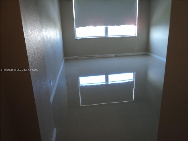 1050 93rd St Unit 6F, Bay Harbor Islands, FL 33154 - spare room featuring plenty of natural light