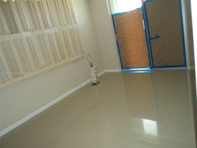 1050 93rd St Unit 6F, Bay Harbor Islands, FL 33154 - unfurnished room featuring baseboards and tile patterned floors