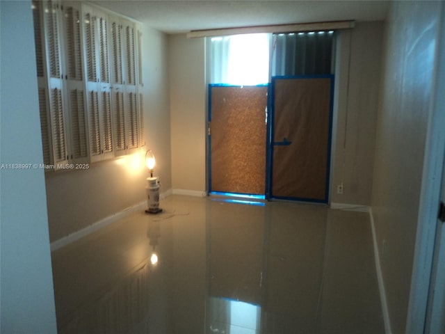 1050 93rd St Unit 6F, Bay Harbor Islands, FL 33154 - empty room featuring baseboards