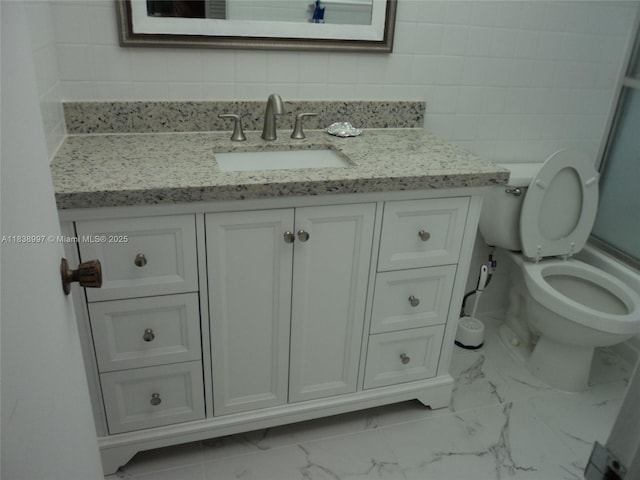 1050 93rd St Unit 6F, Bay Harbor Islands, FL 33154 - bathroom featuring marble finish flooring, vanity, tile walls, and backsplash