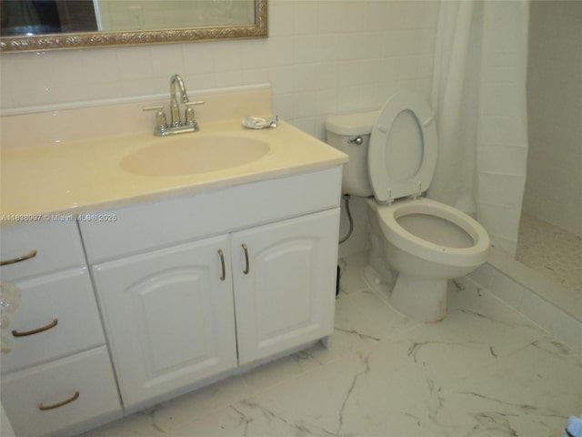 1050 93rd St Unit 6F, Bay Harbor Islands, FL 33154 - bathroom featuring tiled shower, vanity, marble look tile flooring, and tile walls