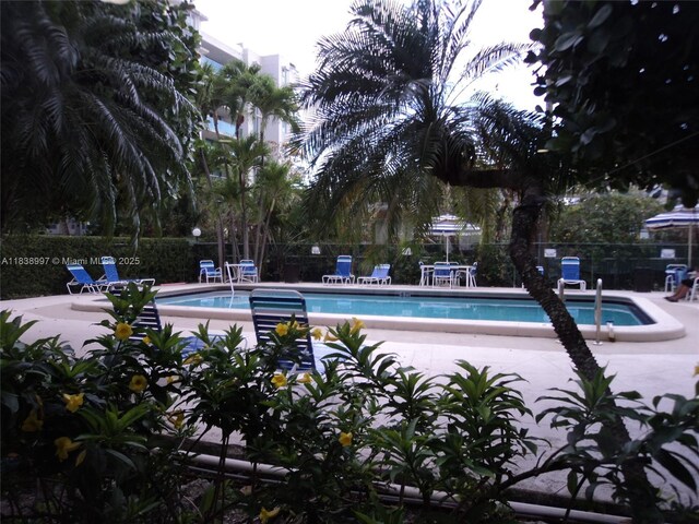 1050 93rd St Unit 6F, Bay Harbor Islands, FL 33154 - community pool with a patio