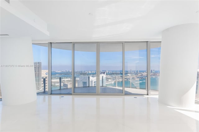 300 Biscayne Blvd Way Unit 4401, Miami, FL 33131 - tiled spare room with expansive windows and a water view