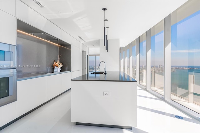 300 Biscayne Blvd Way Unit 4401, Miami, FL 33131 - kitchen with modern cabinets, white cabinets, stainless steel appliances, dark countertops, and a water view