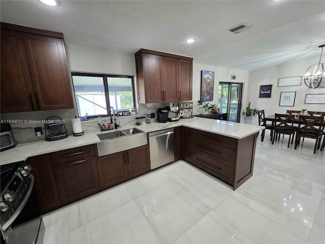 10120 NW 71st Pl, Tamarac, FL 33321 - kitchen with range, dishwasher, a peninsula, light stone counters, and recessed lighting