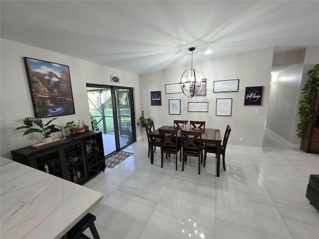 10120 NW 71st Pl, Tamarac, FL 33321 - dining space featuring a chandelier and light tile patterned floors