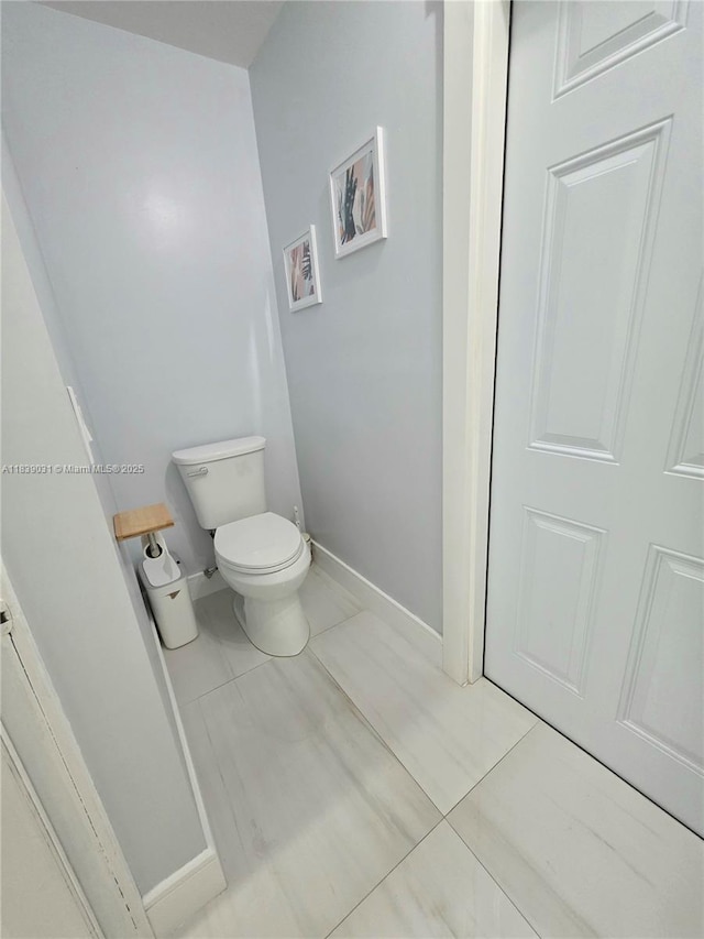 10120 NW 71st Pl, Tamarac, FL 33321 - bathroom featuring toilet and baseboards