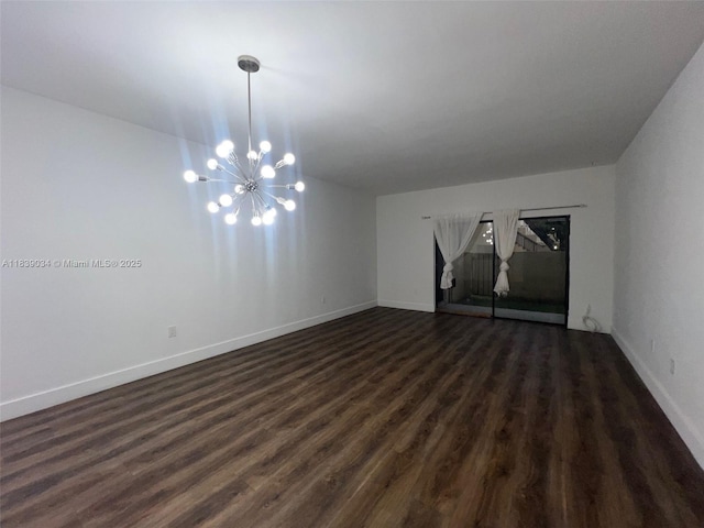 8831 SW 130th Pl Unit 106, Miami, FL 33186 - spare room with a chandelier and dark wood-type flooring