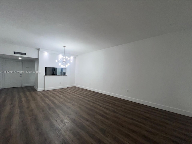 8831 SW 130th Pl Unit 106, Miami, FL 33186 - unfurnished living room featuring dark wood-style floors and a chandelier