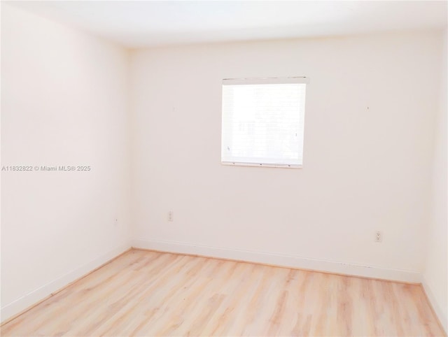 8605 SW 68th Ct Unit 22, Pinecrest, FL 33156 - spare room with wood finished floors and baseboards