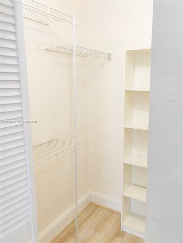 8605 SW 68th Ct Unit 22, Pinecrest, FL 33156 - spacious closet with wood finished floors