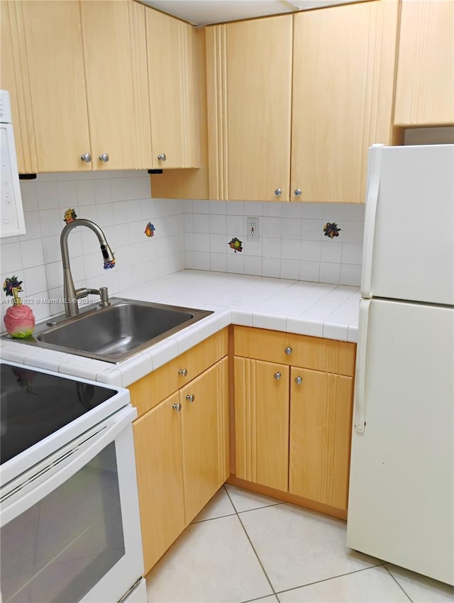 8605 SW 68th Ct Unit 22, Pinecrest, FL 33156 - kitchen featuring white appliances, tasteful backsplash, light countertops, and light brown cabinets