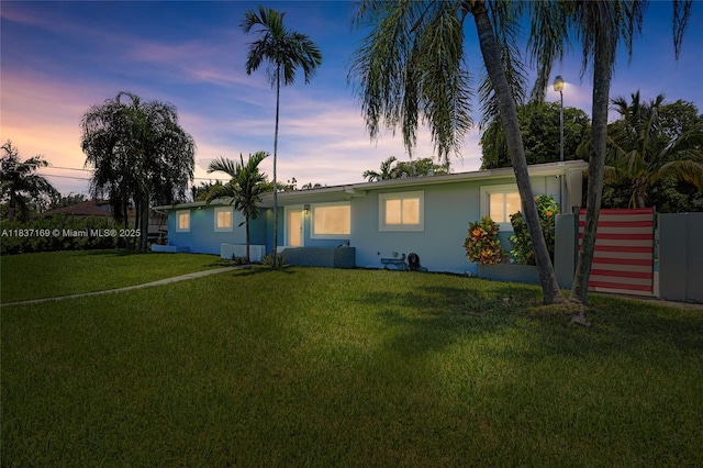 16000 N Miami Ave, Miami, FL 33169 - ranch-style house with stucco siding and a yard