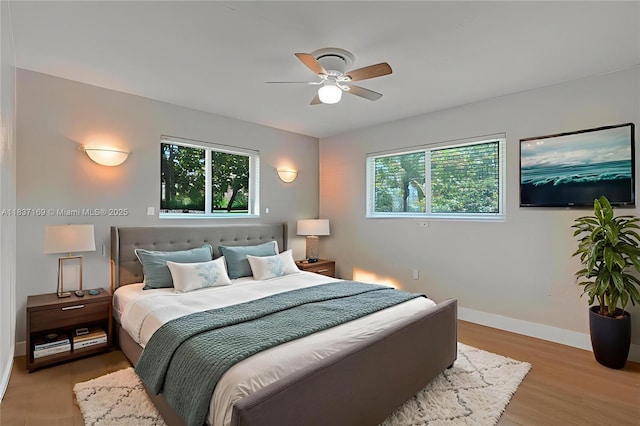 16000 N Miami Ave, Miami, FL 33169 - bedroom featuring baseboards and light wood-style floors
