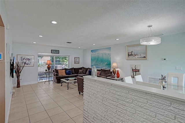 16000 N Miami Ave, Miami, FL 33169 - living area with light tile patterned floors, a textured ceiling, and recessed lighting