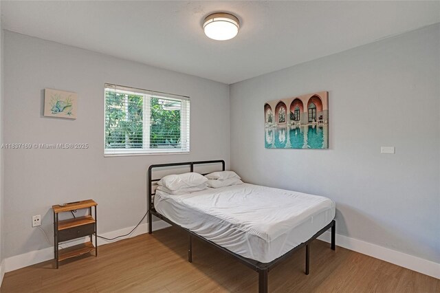 16000 N Miami Ave, Miami, FL 33169 - bedroom with light wood-style flooring and baseboards