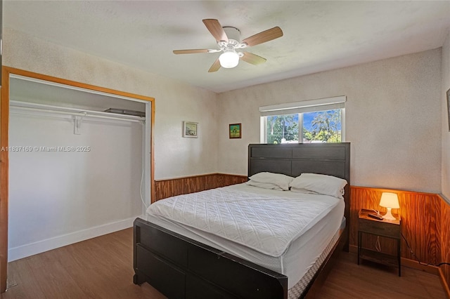 16000 N Miami Ave, Miami, FL 33169 - bedroom featuring wood finished floors, a closet, a ceiling fan, and wooden walls