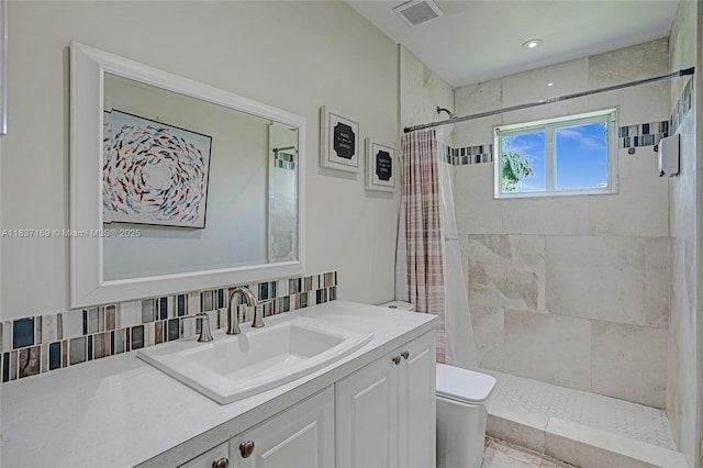 16000 N Miami Ave, Miami, FL 33169 - bathroom with vanity, a tile shower, and backsplash