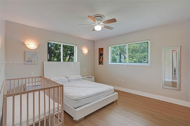 16000 N Miami Ave, Miami, FL 33169 - bedroom featuring multiple windows and wood finished floors