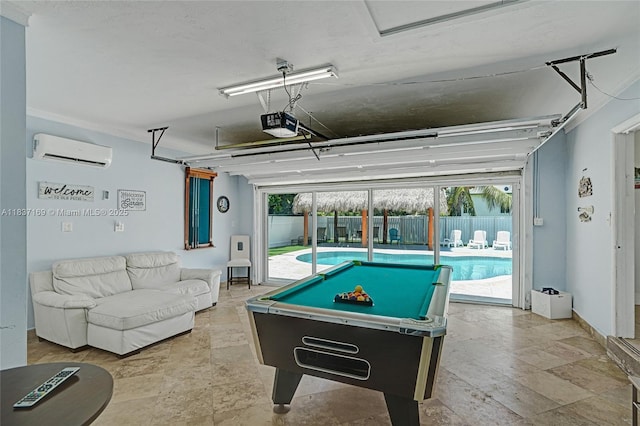 16000 N Miami Ave, Miami, FL 33169 - rec room featuring an AC wall unit, stone tile flooring, billiards, and plenty of natural light