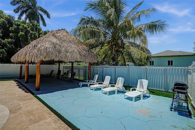 16000 N Miami Ave, Miami, FL 33169 - fenced backyard with a gazebo, a patio, and grilling area