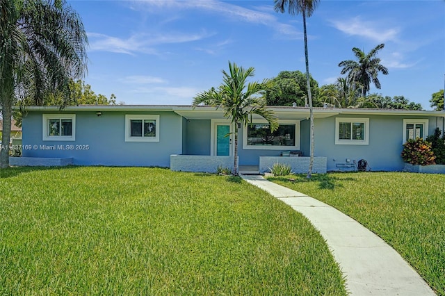 16000 N Miami Ave, Miami, FL 33169 - ranch-style house with stucco siding and a front yard