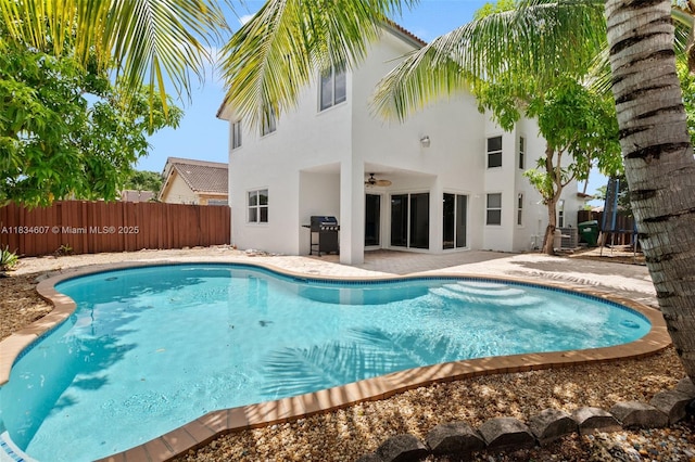 14834 SW 140th St, Miami, FL 33196 - view of pool with grilling area, a fenced backyard, a patio, and a ceiling fan