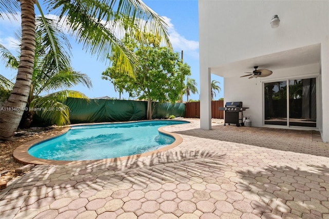 14834 SW 140th St, Miami, FL 33196 - view of pool featuring a grill, a ceiling fan, a fenced backyard, and a patio area