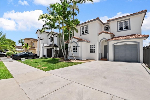 14834 SW 140th St, Miami, FL 33196 - mediterranean / spanish house featuring stucco siding, a tiled roof, concrete driveway, and an attached garage
