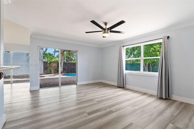 14834 SW 140th St, Miami, FL 33196 - unfurnished room with plenty of natural light, ceiling fan, crown molding, and light wood-style floors