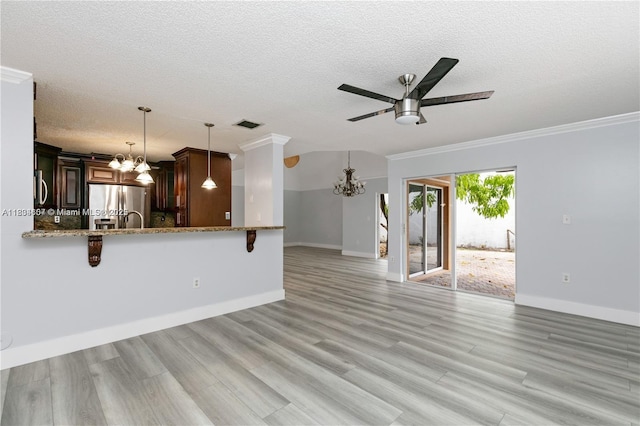 14834 SW 140th St, Miami, FL 33196 - unfurnished living room featuring a chandelier, ceiling fan, crown molding, a textured ceiling, and light wood-style flooring
