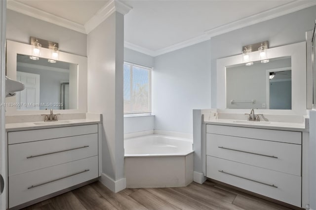 14834 SW 140th St, Miami, FL 33196 - bathroom featuring wood finished floors, crown molding, two vanities, a garden tub, and a ceiling fan