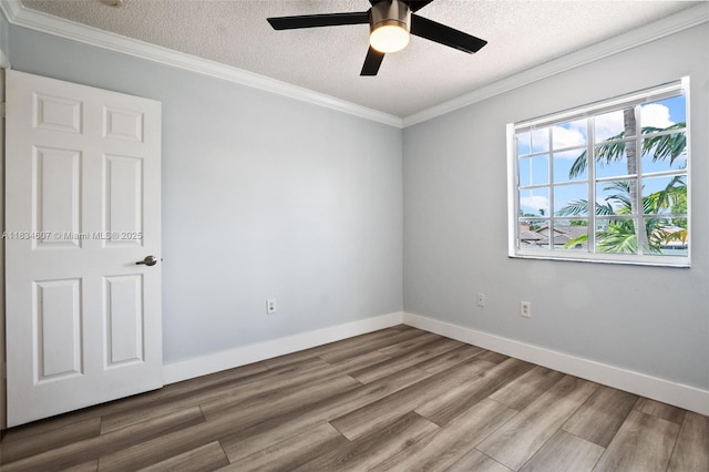 14834 SW 140th St, Miami, FL 33196 - empty room featuring a textured ceiling, wood finished floors, a ceiling fan, and crown molding