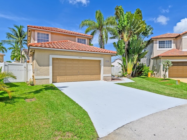 18232 SW 5th St, Pembroke Pines, FL 33029 - mediterranean / spanish-style home featuring stucco siding, a tile roof, concrete driveway, a gate, and an attached garage