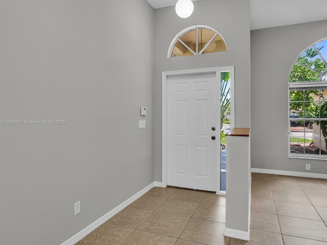 18232 SW 5th St, Pembroke Pines, FL 33029 - entrance foyer with light tile patterned floors and baseboards