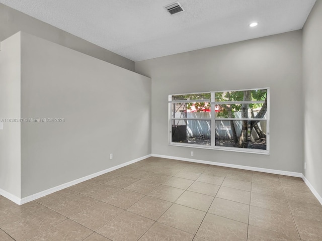 18232 SW 5th St, Pembroke Pines, FL 33029 - tiled empty room featuring recessed lighting and a textured ceiling