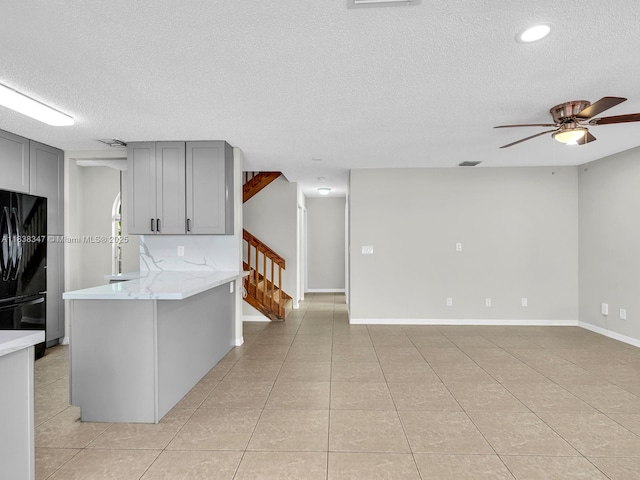 18232 SW 5th St, Pembroke Pines, FL 33029 - kitchen featuring freestanding refrigerator, gray cabinets, a textured ceiling, light tile patterned floors, and a ceiling fan