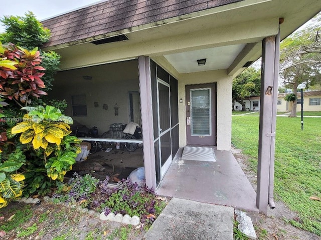 3635 SW Natura Ave Unit A, Deerfield Beach, FL 33441 - property entrance featuring roof with shingles, a yard, and mansard roof
