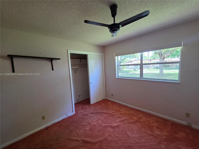 3635 SW Natura Ave Unit A, Deerfield Beach, FL 33441 - unfurnished bedroom featuring a textured ceiling, carpet, a closet, and a ceiling fan