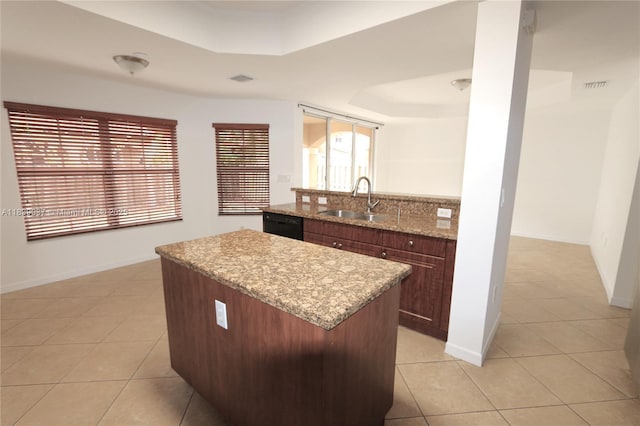 3001 SW 156th Ave, Miami, FL 33185 - kitchen with a raised ceiling, light tile patterned floors, a center island, light stone counters, and dishwasher