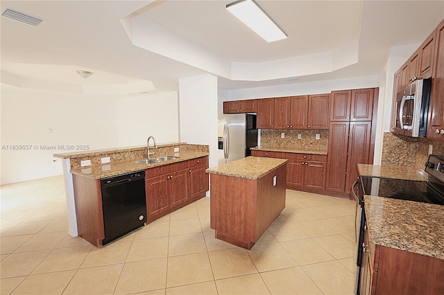 3001 SW 156th Ave, Miami, FL 33185 - kitchen featuring a raised ceiling, appliances with stainless steel finishes, and decorative backsplash