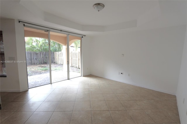 3001 SW 156th Ave, Miami, FL 33185 - spare room with tile patterned floors and a raised ceiling