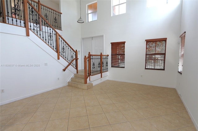 3001 SW 156th Ave, Miami, FL 33185 - foyer featuring a towering ceiling, tile patterned floors, and stairway